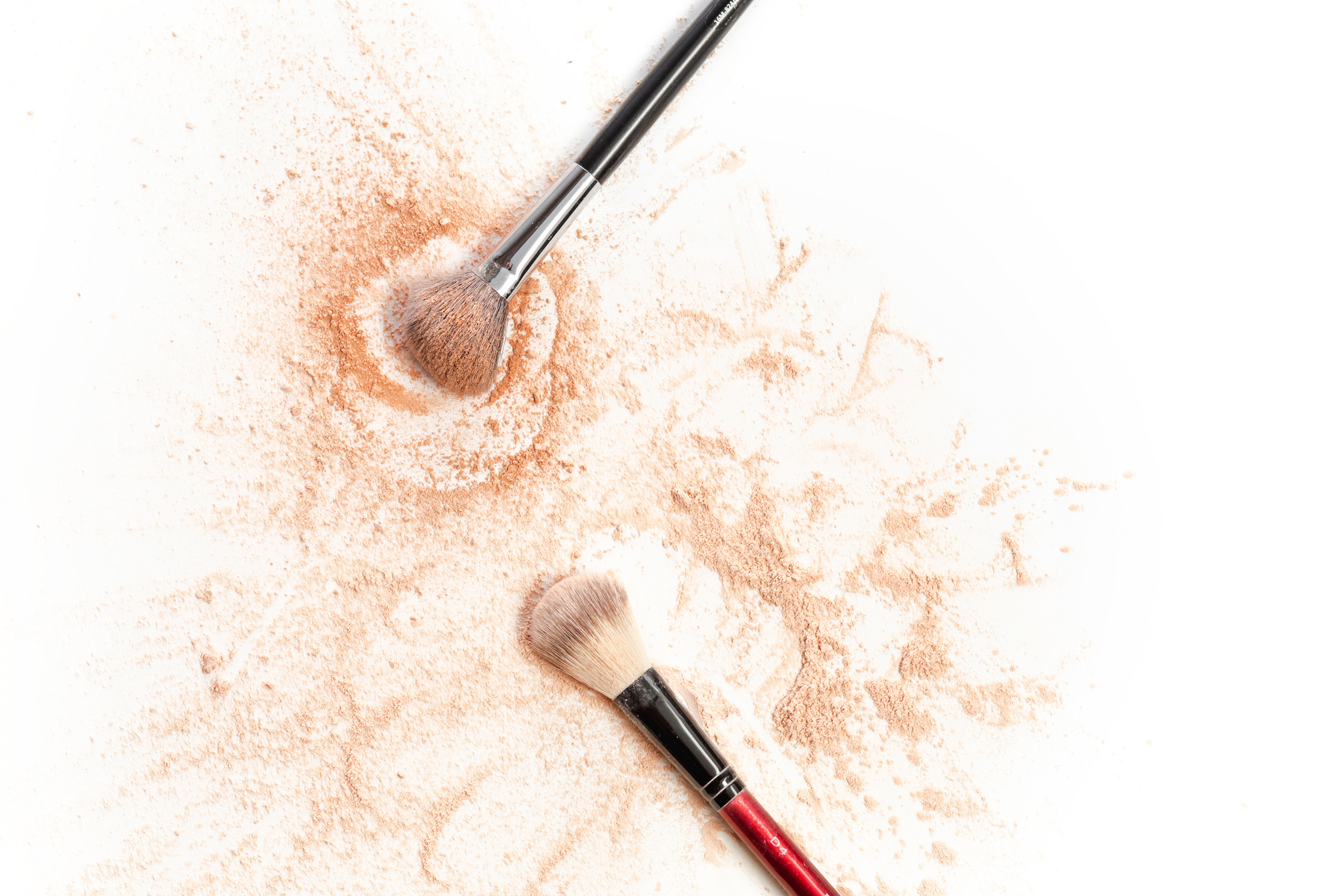 Close-up of Crushed Shimmer Powder with Makeup Brush